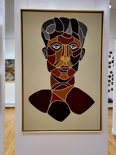 Cuadro del busto de un hombre pintado en mosaico